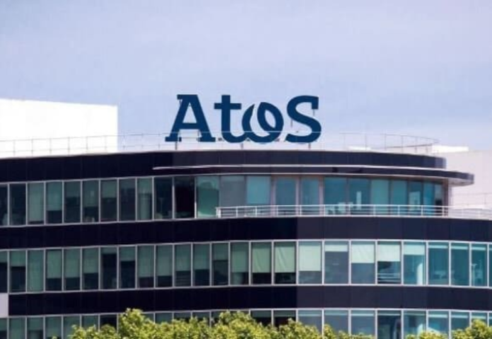 Atos postpones share sale for bank talks, shares drop